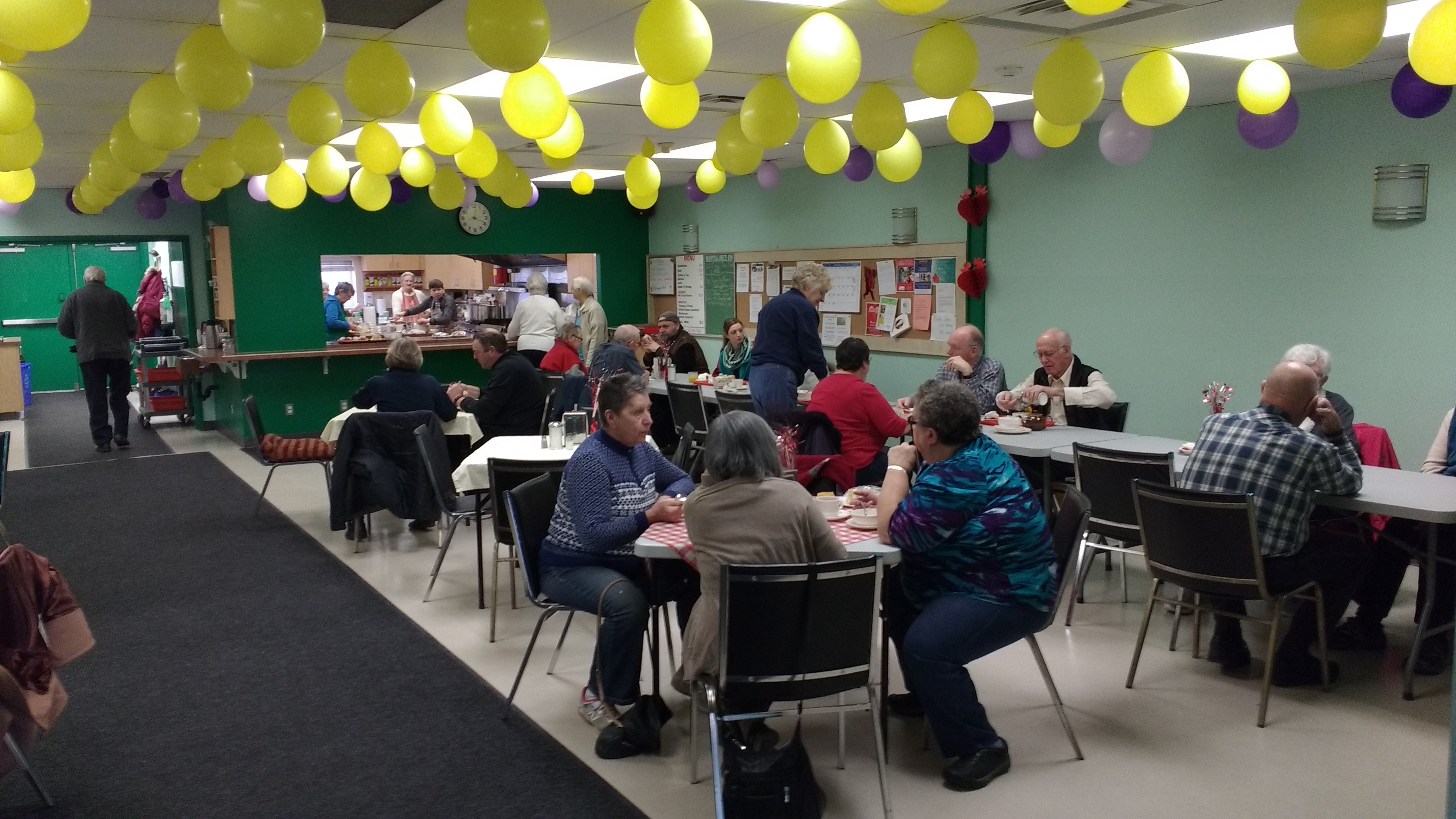 Photo of seniors socializing over lunch